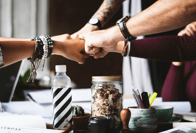 business success tea fist pump