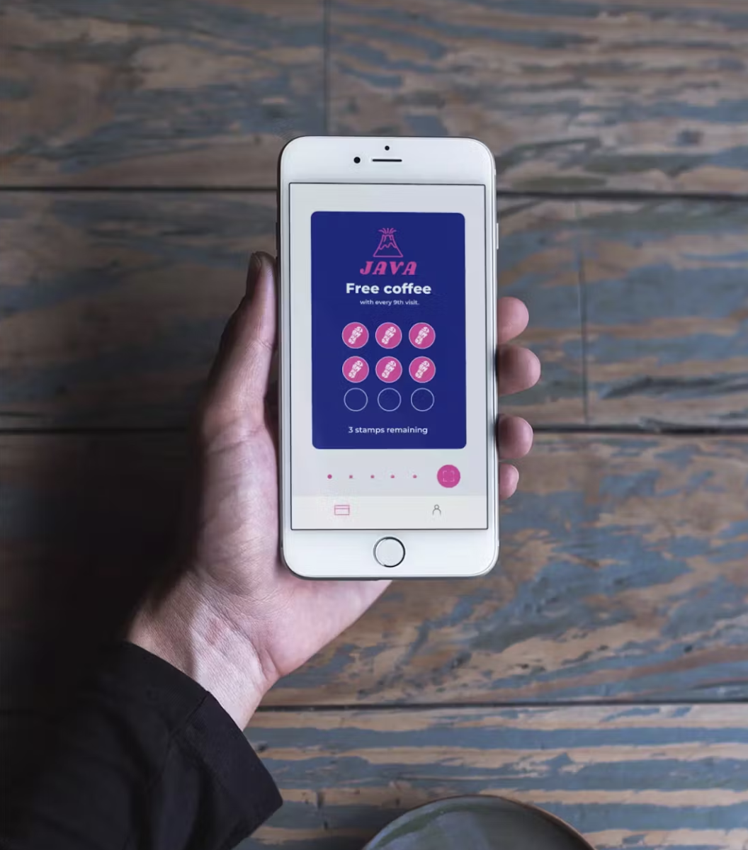Stampede app being held in a hand. 