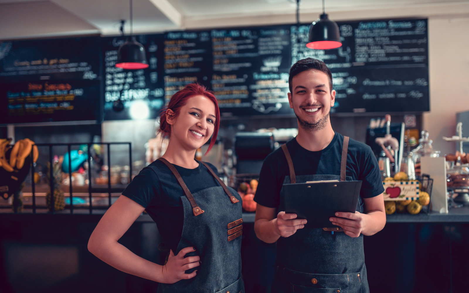 Smoothie bar workers smiling during a day shift. 