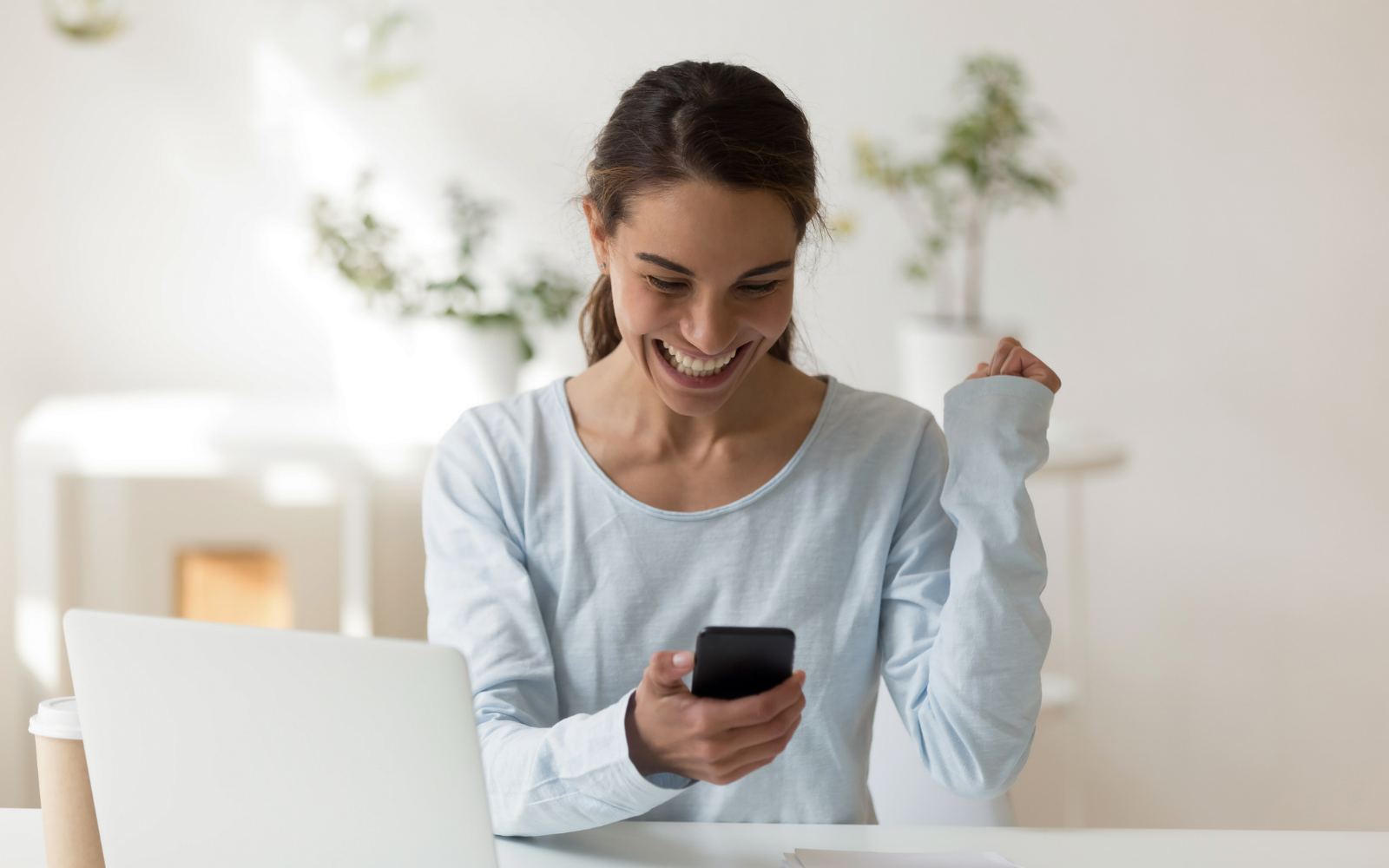 Person looking excited at their phone