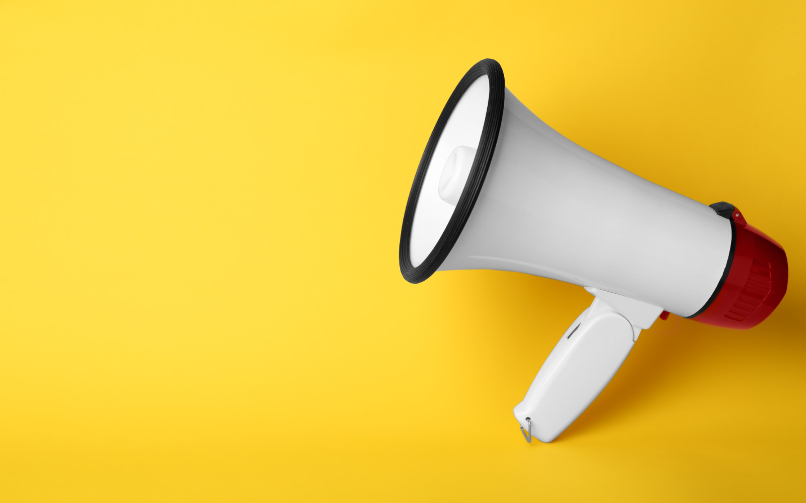 Megaphone in front of yellow background