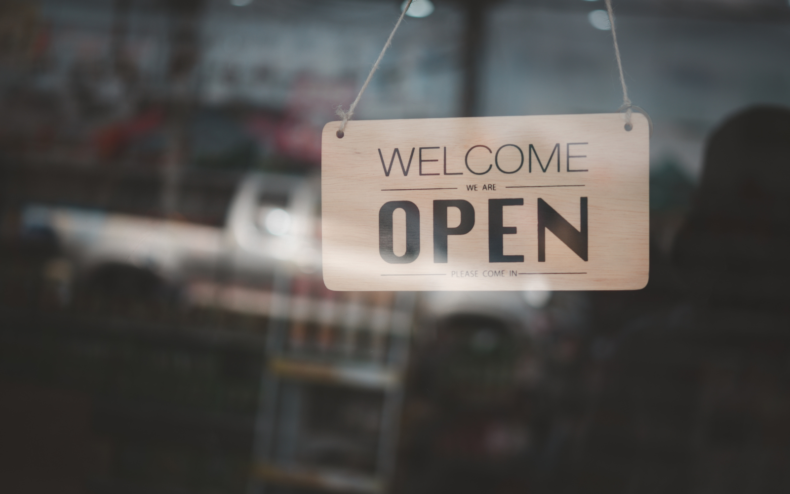 Opening hours sign in a window. 