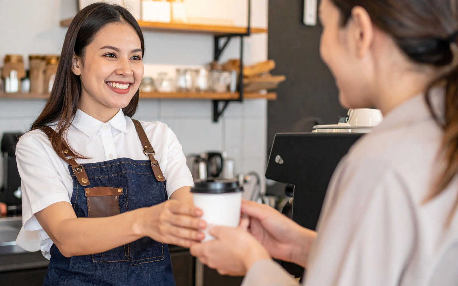 Customer receiving loyalty reward at a local Australian cafe in 2026
