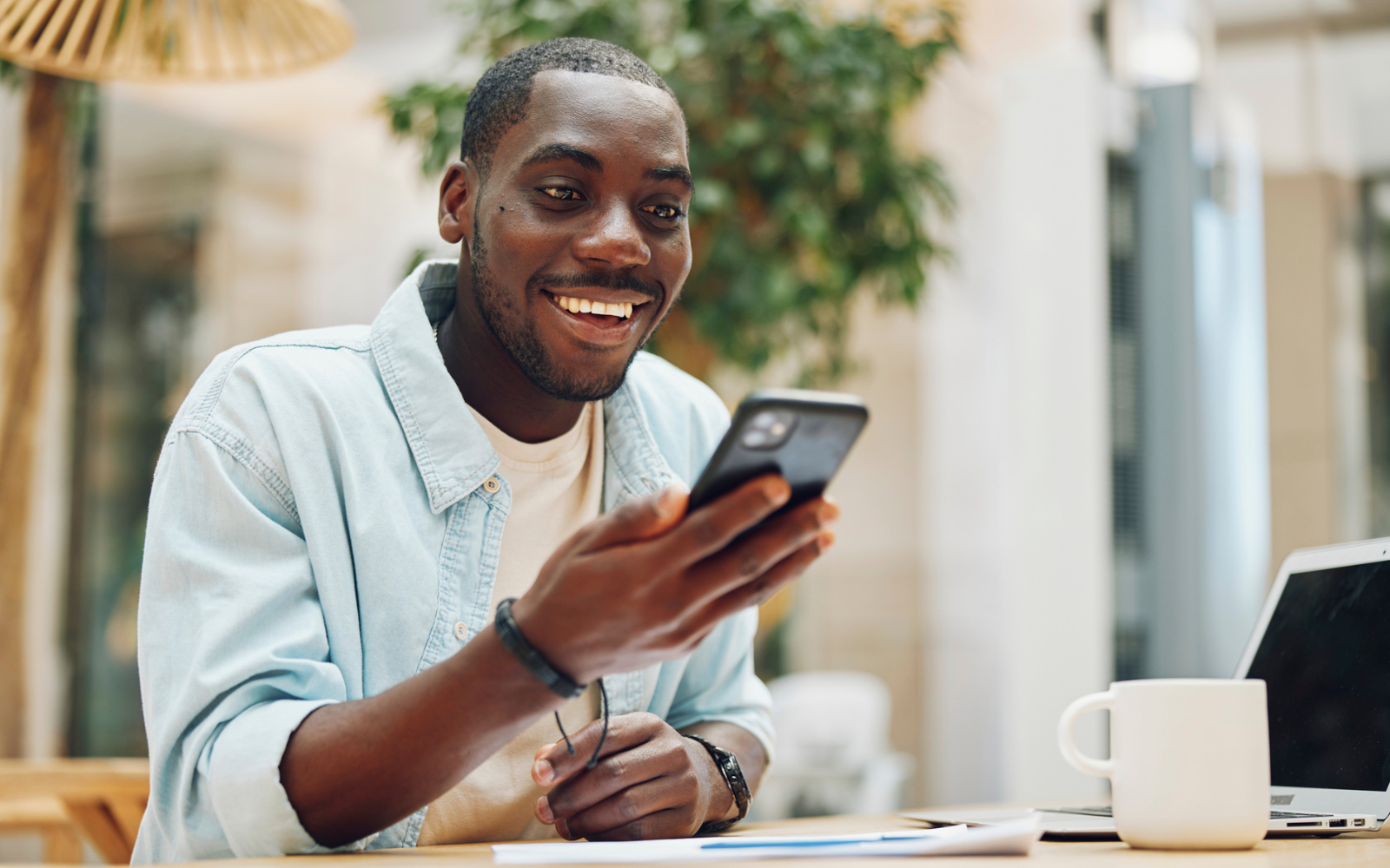 A small cafe customer using a digital loyalty app on a mobile phone