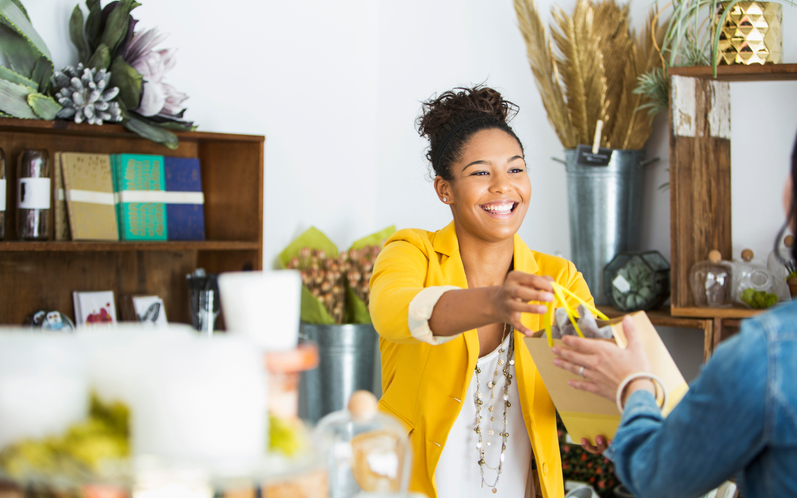 A store owner offering a personalised experience for their customer. 