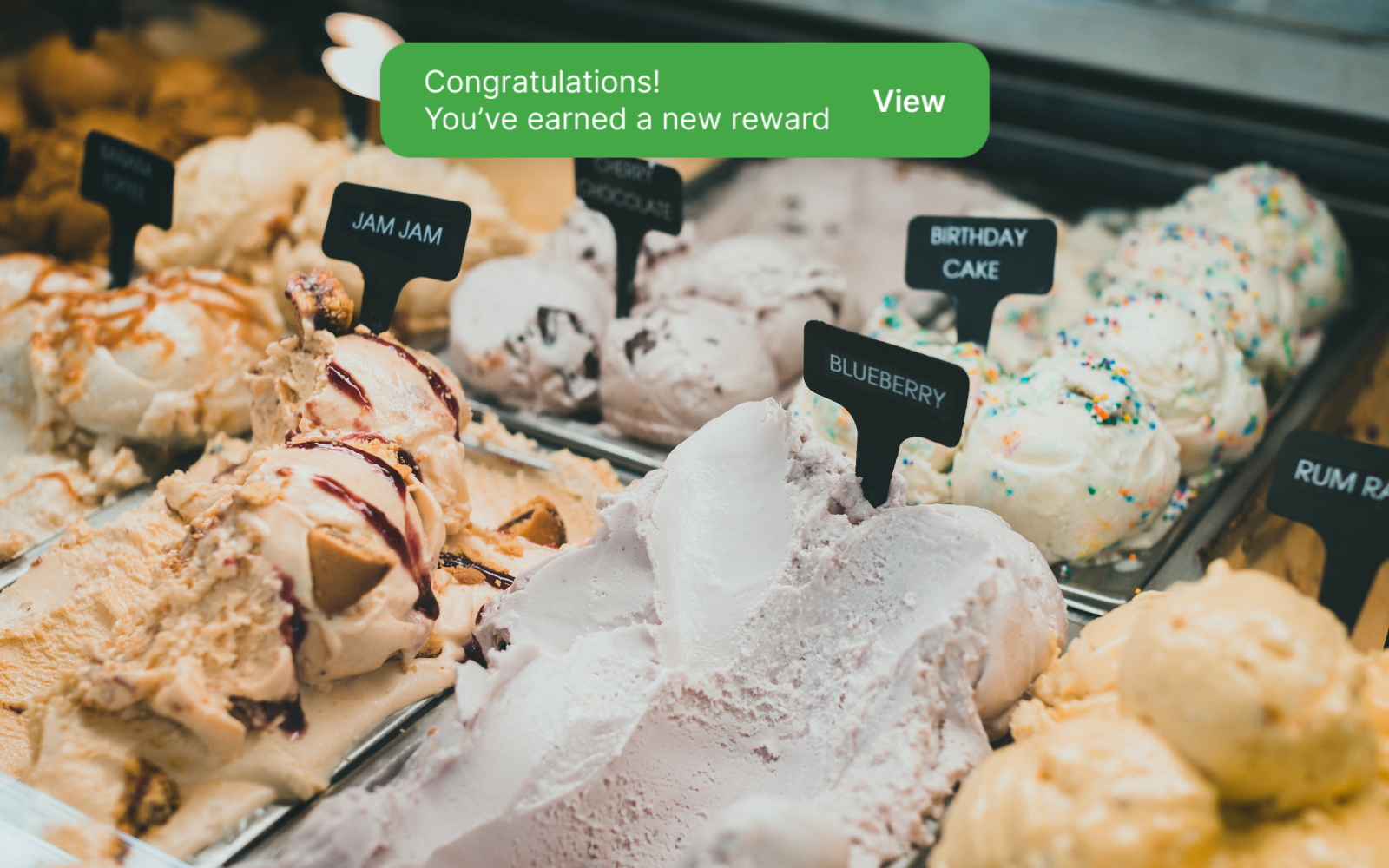 a person earning a reward from their digital loyalty program with a US ice cream shop